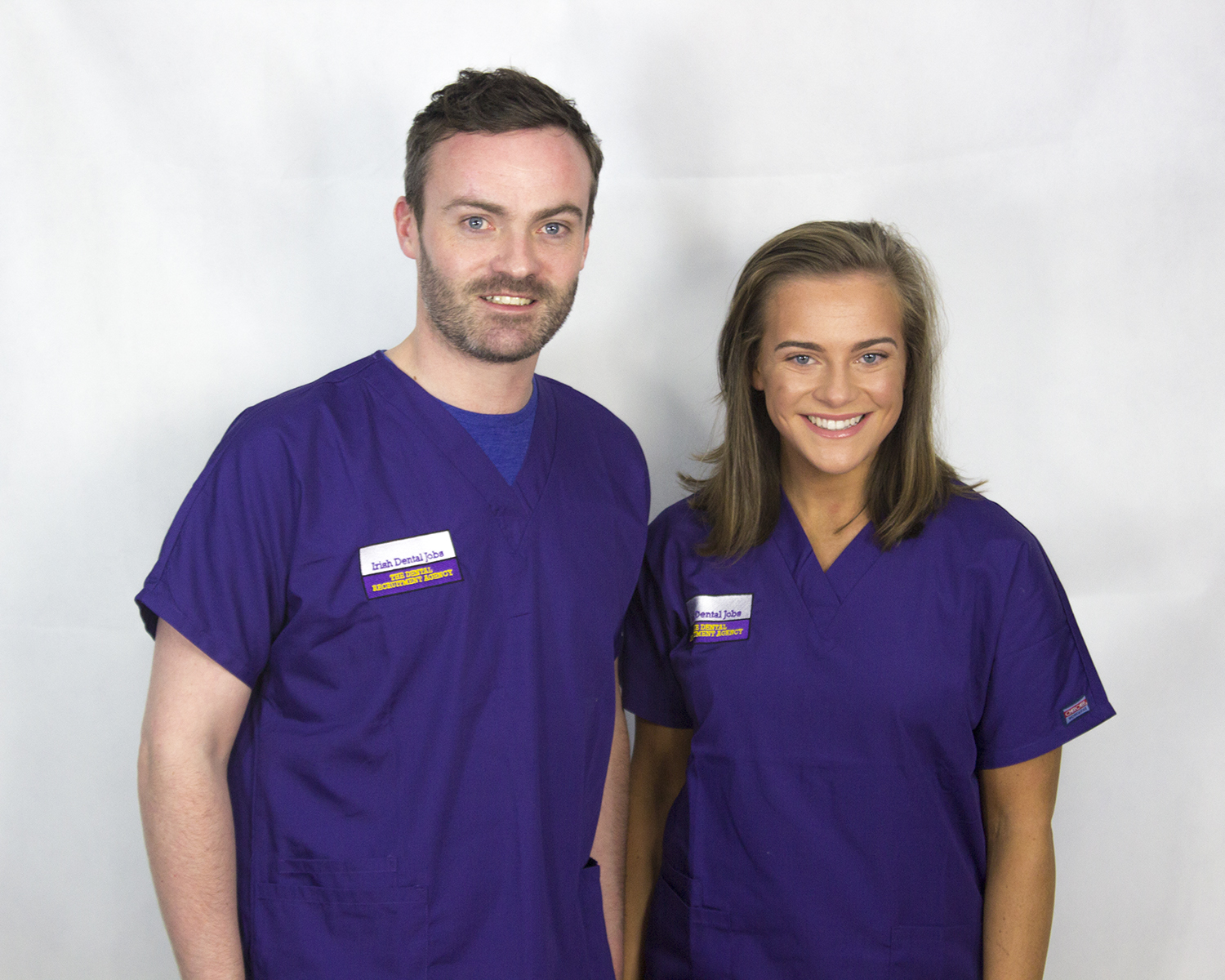Thomas and Alice wearing scrubs